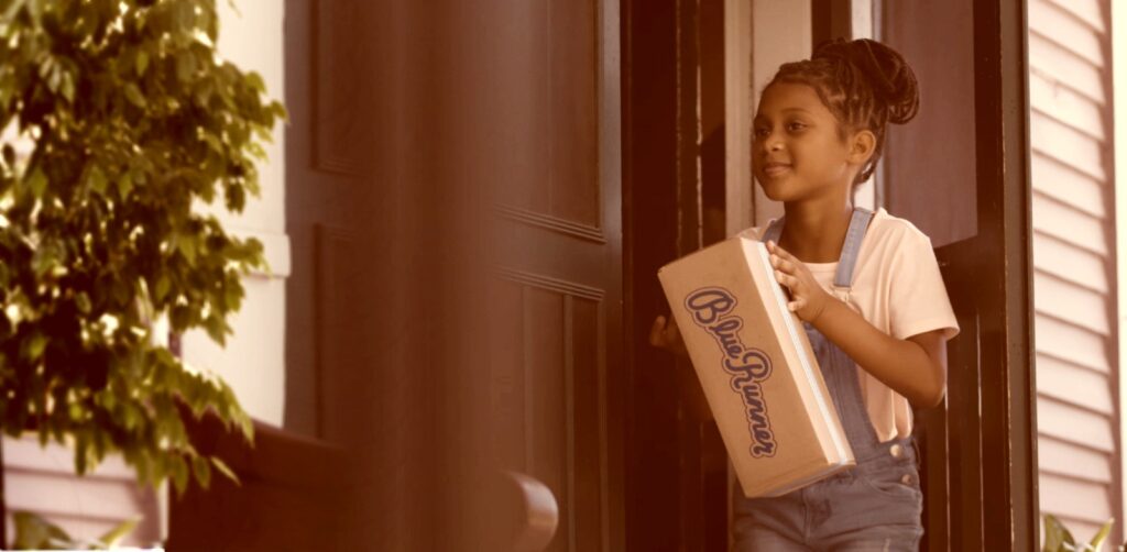 Blue Runner Frame from Video Production. Girl going in front door of New Orleans Home with Blue Runner Box